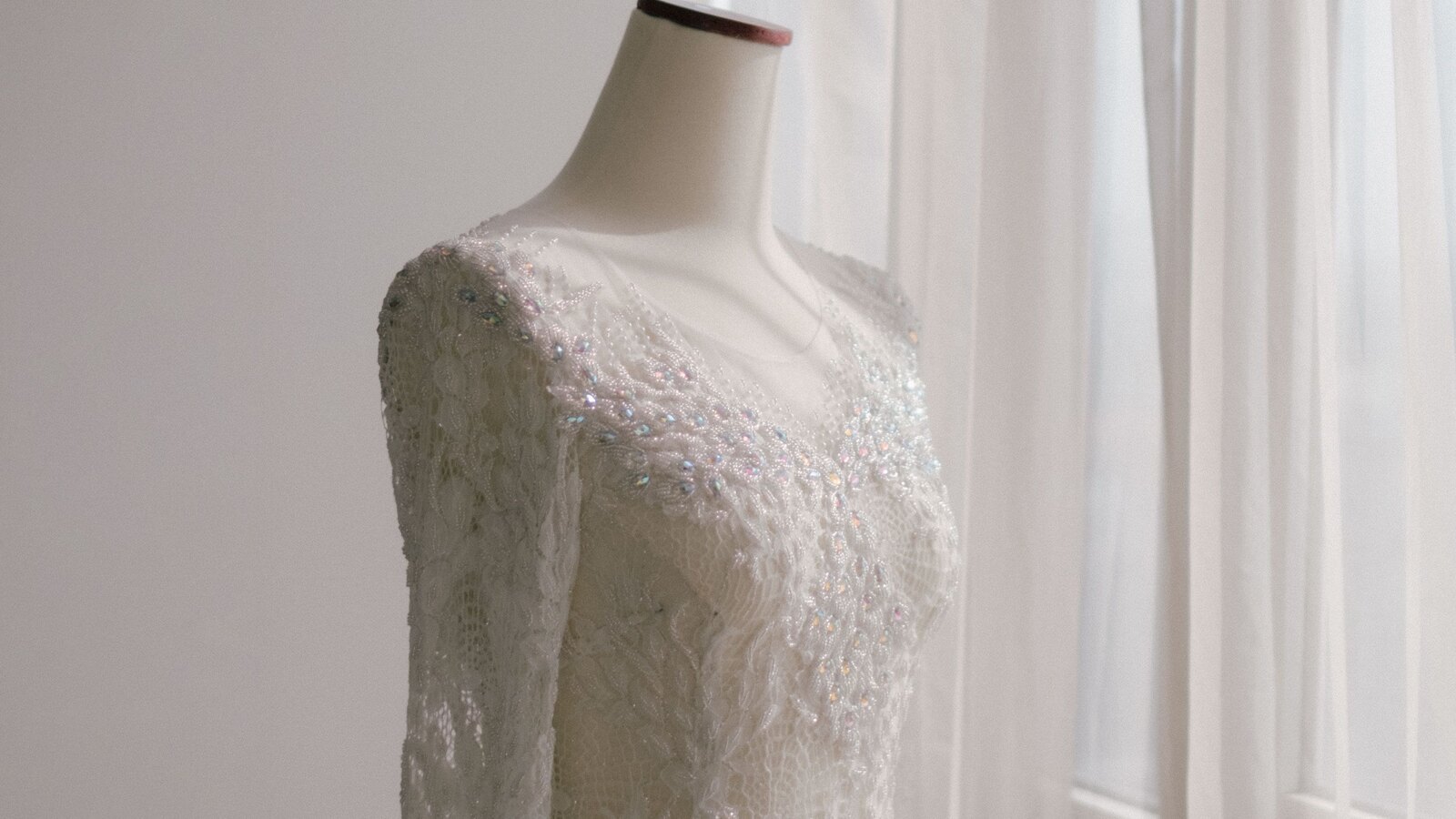Bridal boutique interior with cream walls and tall windows