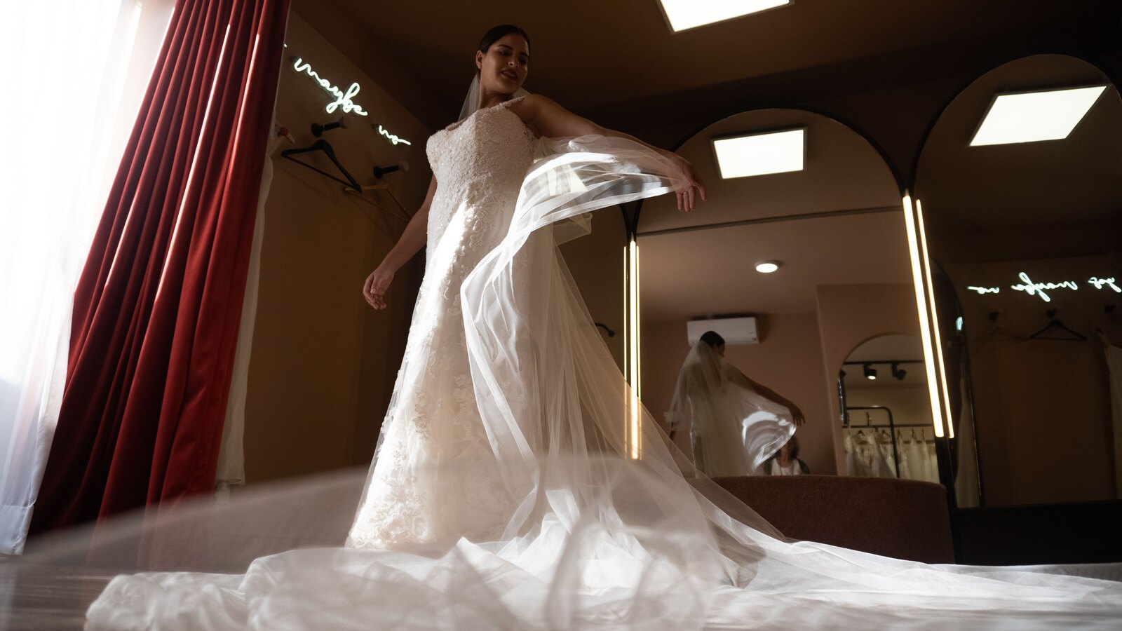 Bride at the mirror in a fitting room